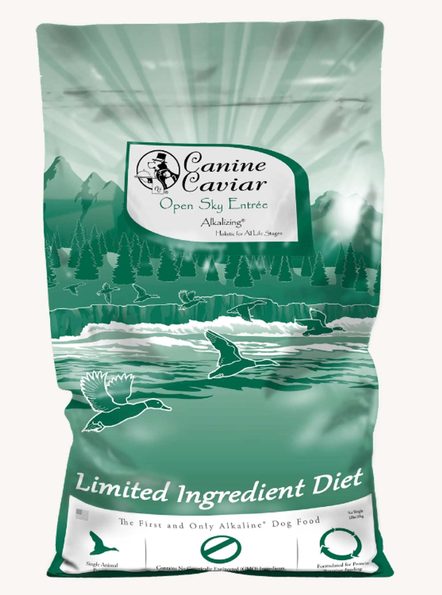 Green bag of Canine Caviar Open Sky Entree dog food with a scenic design.