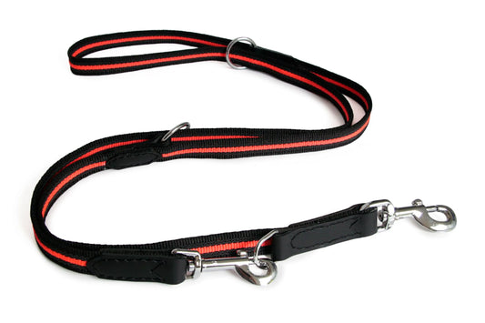 Black and red dog leash with metal clip on a white background