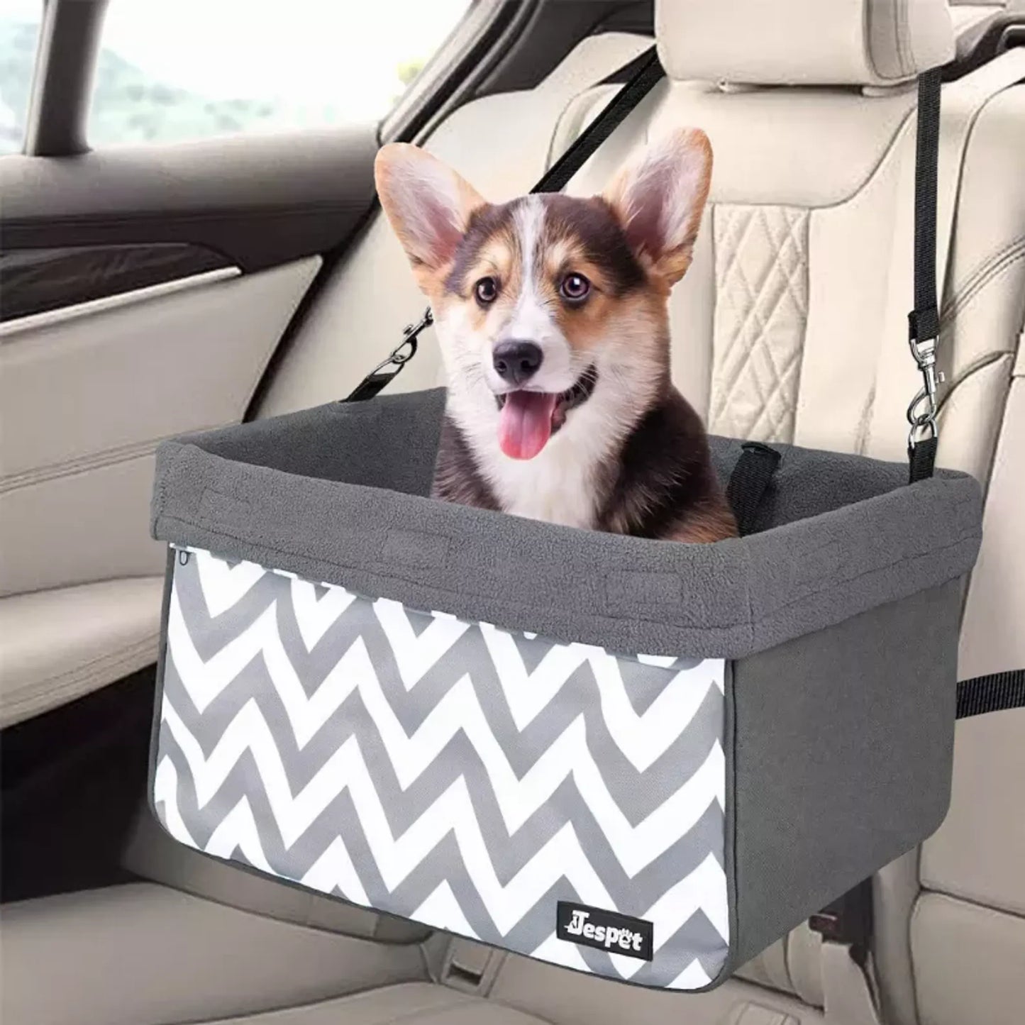 Dog in a car seat with a zigzag pattern in a vehicle
