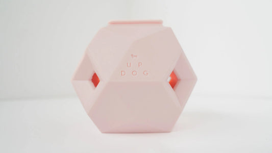 Pink hexagonal dog toy with 'UP DOG' branding on a white background