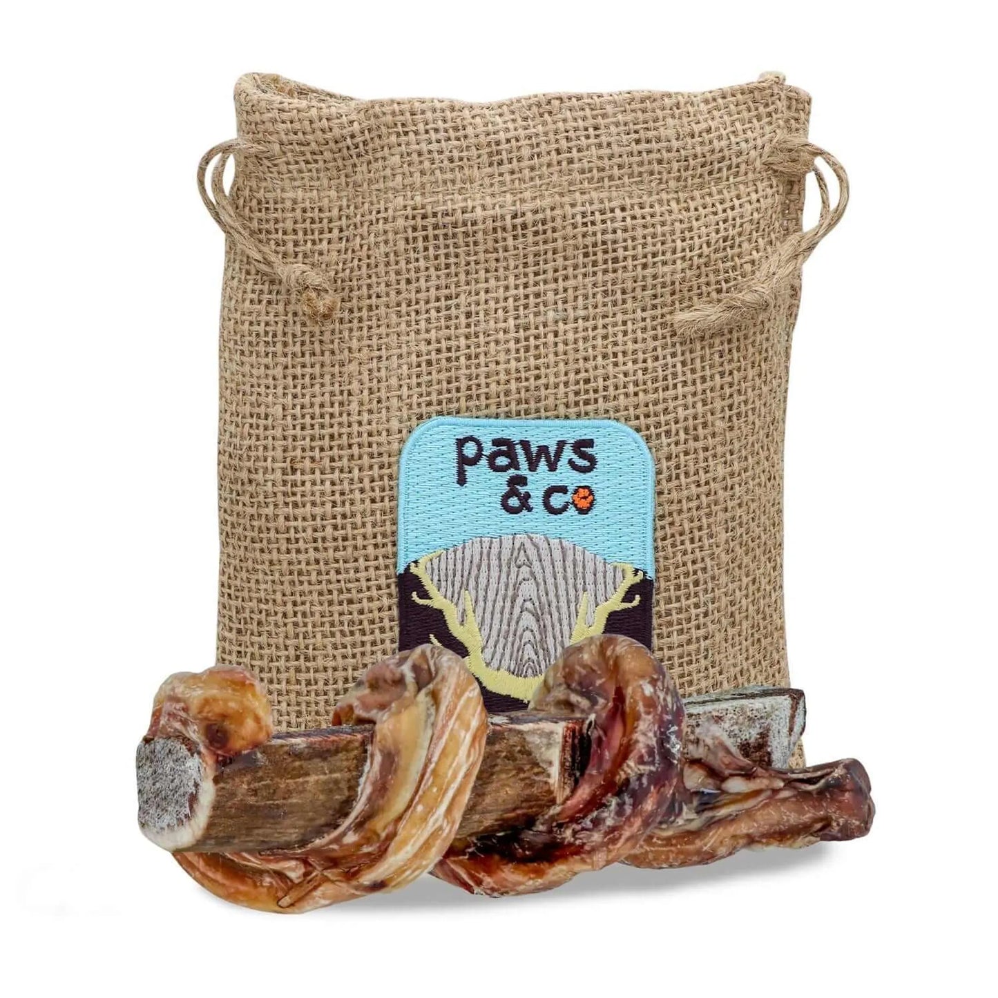Dog chew treat in a 'paws & co' branded burlap bag on a white background