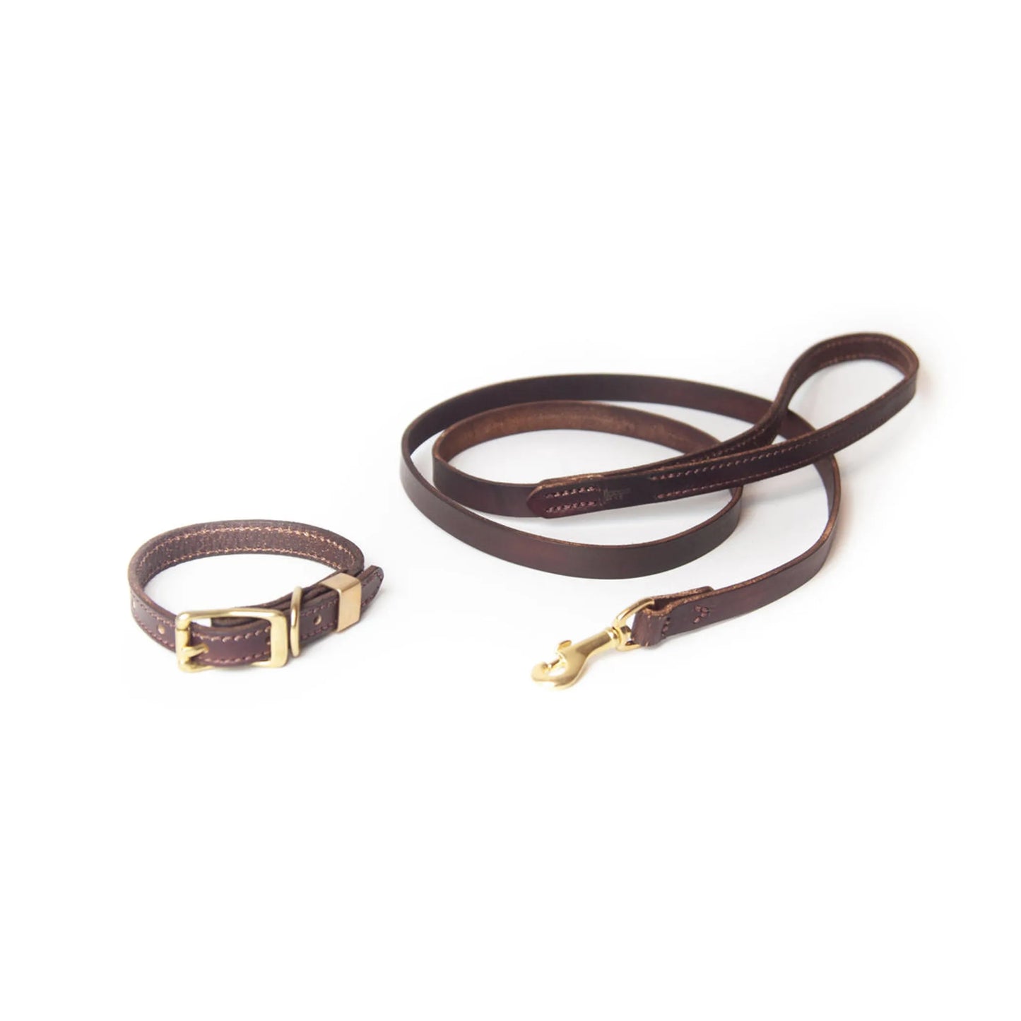 Brown leather dog collar and leash set on a white background