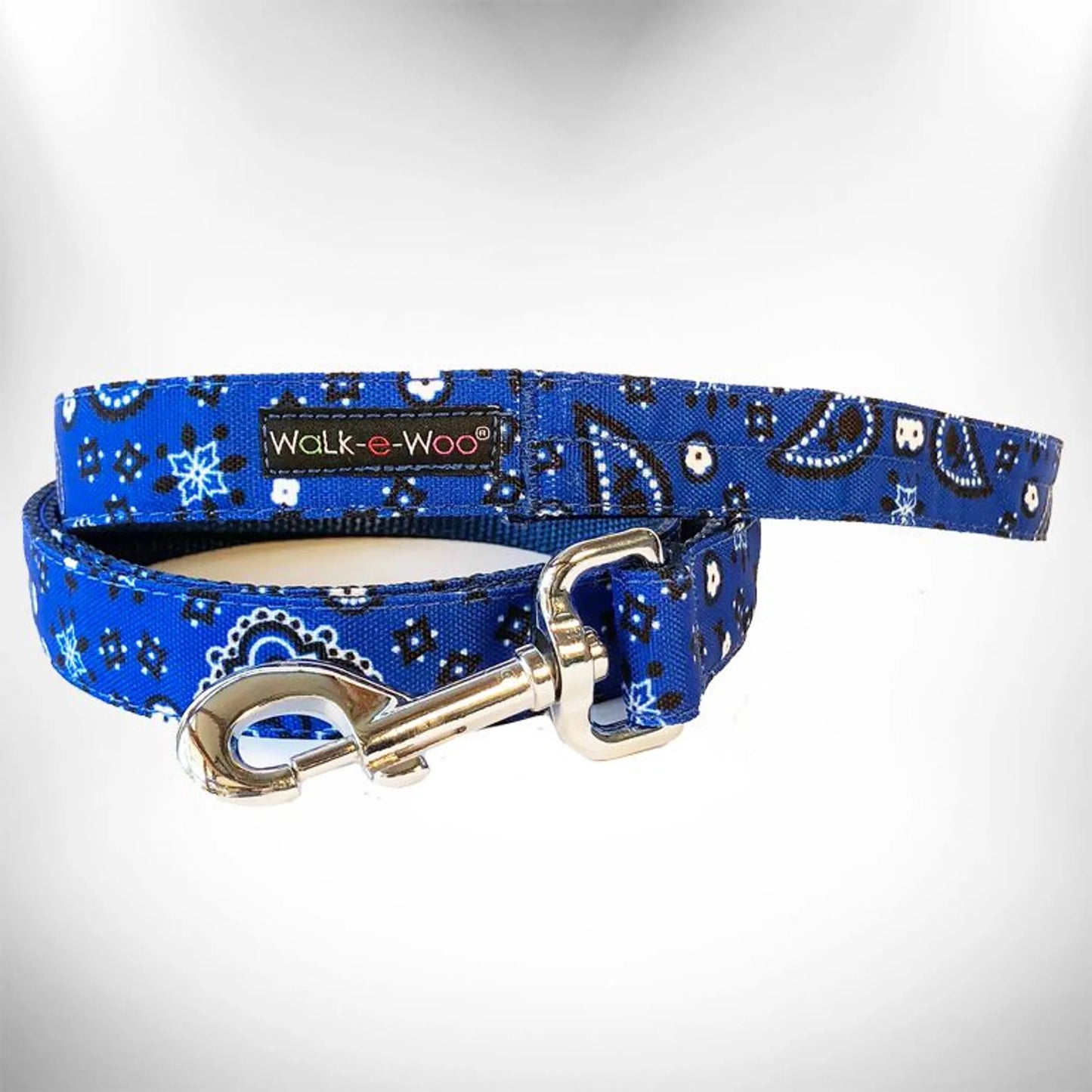 Blue patterned dog leash with gold clasp on a white background