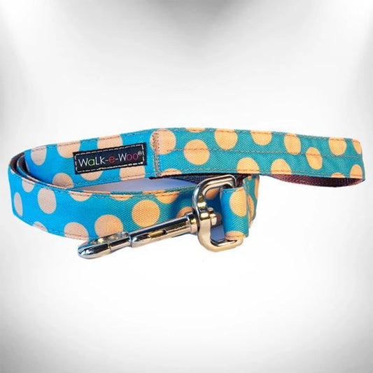 Dog leash with blue and orange polka dot pattern on a white background