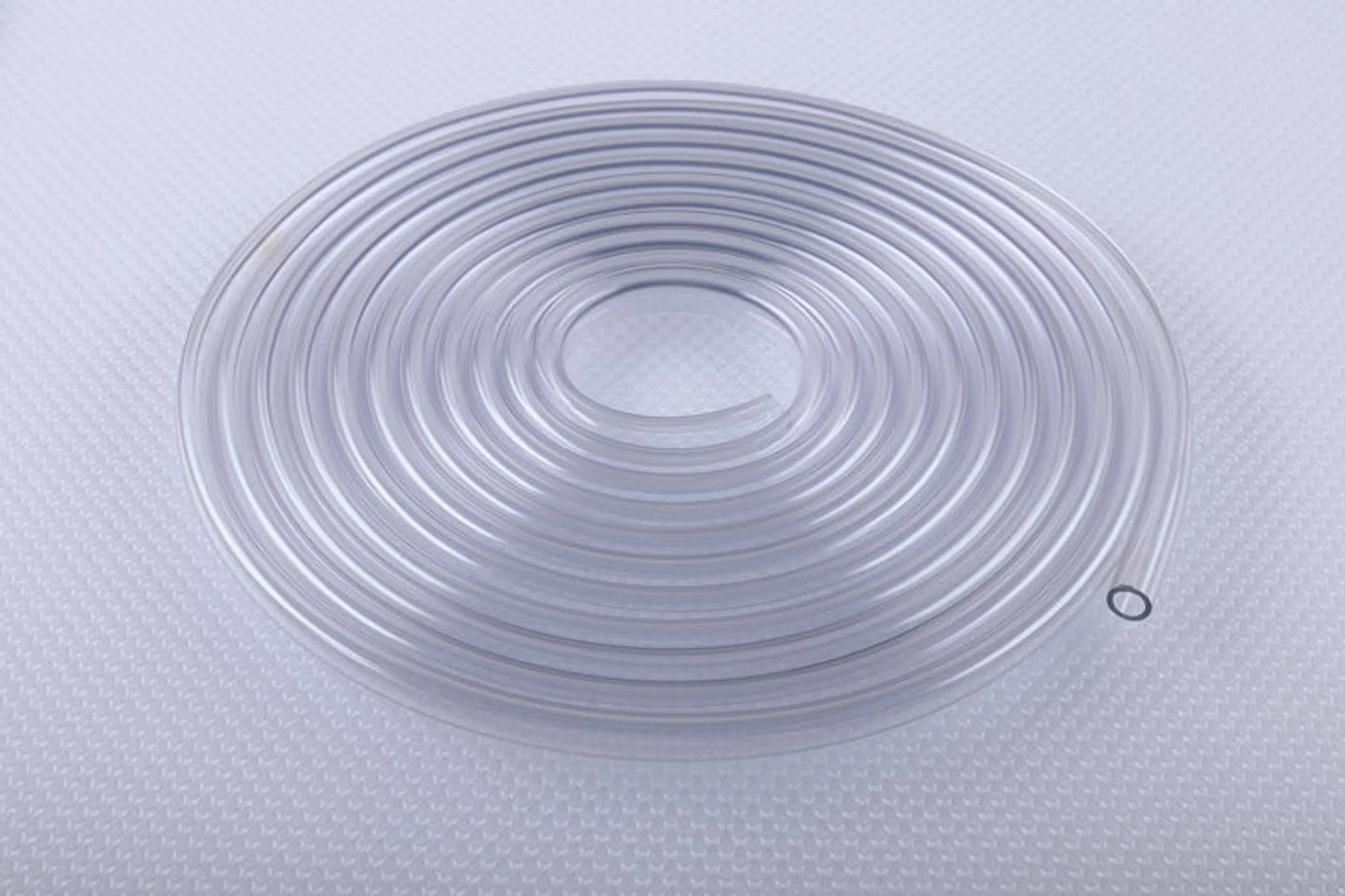 Clear silicone mat with circular patterns on a textured gray surface