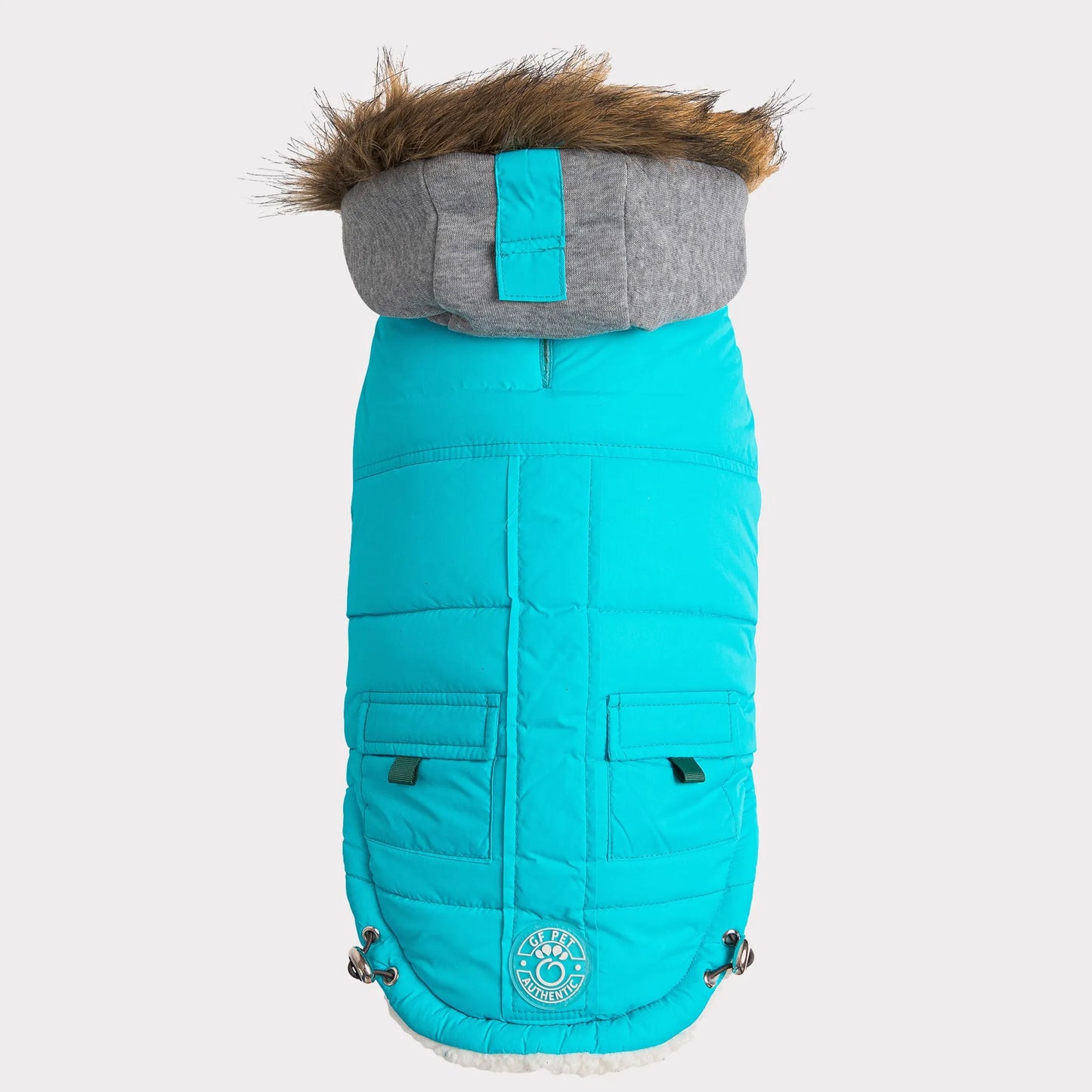 Turquoise dog coat with gray hood and fur trim on a white background
