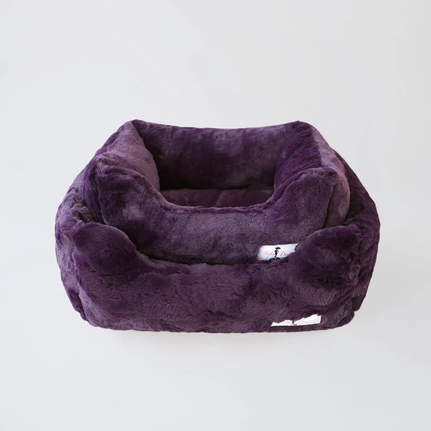 Purple pet bed on a white background