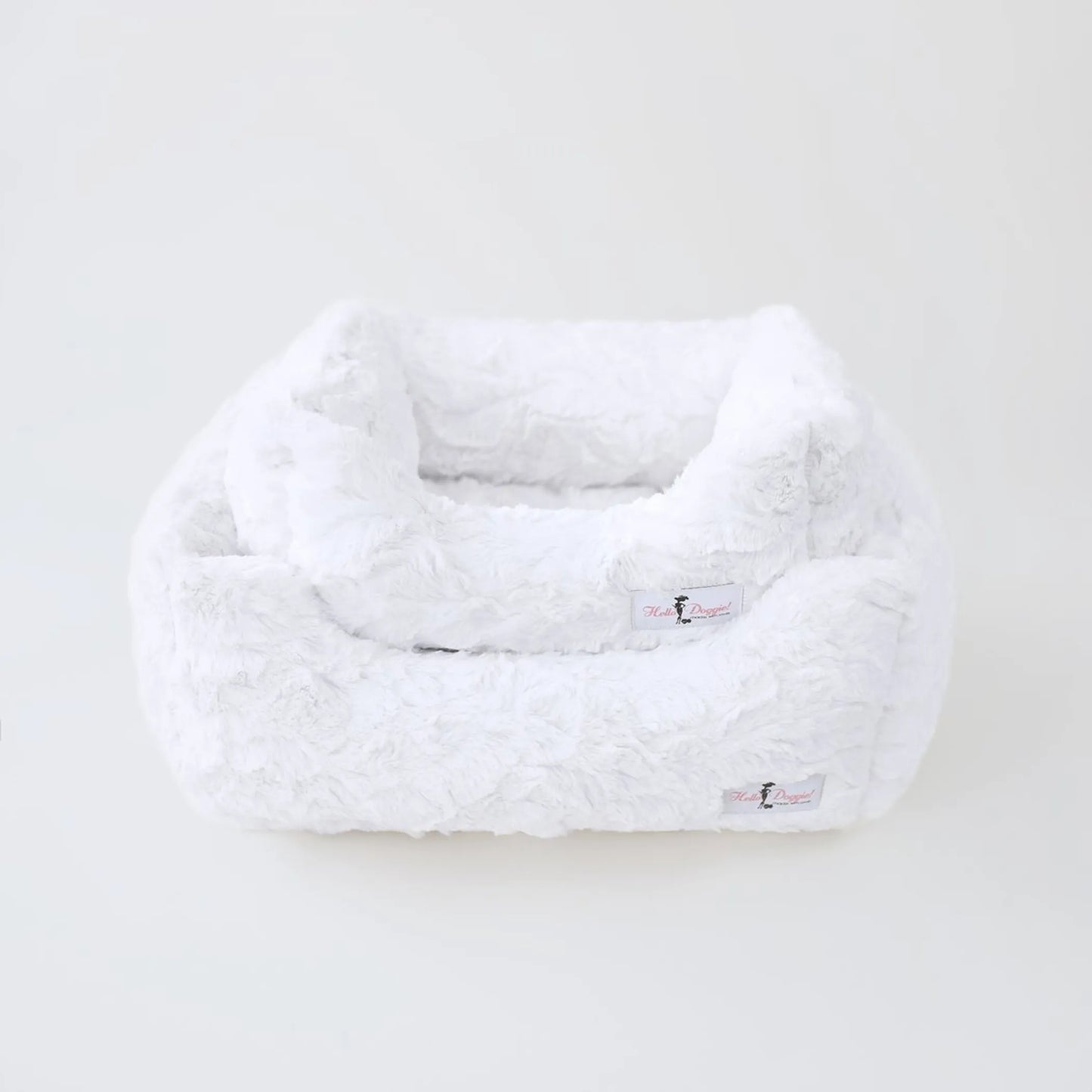 White fluffy pet bed on a white background
