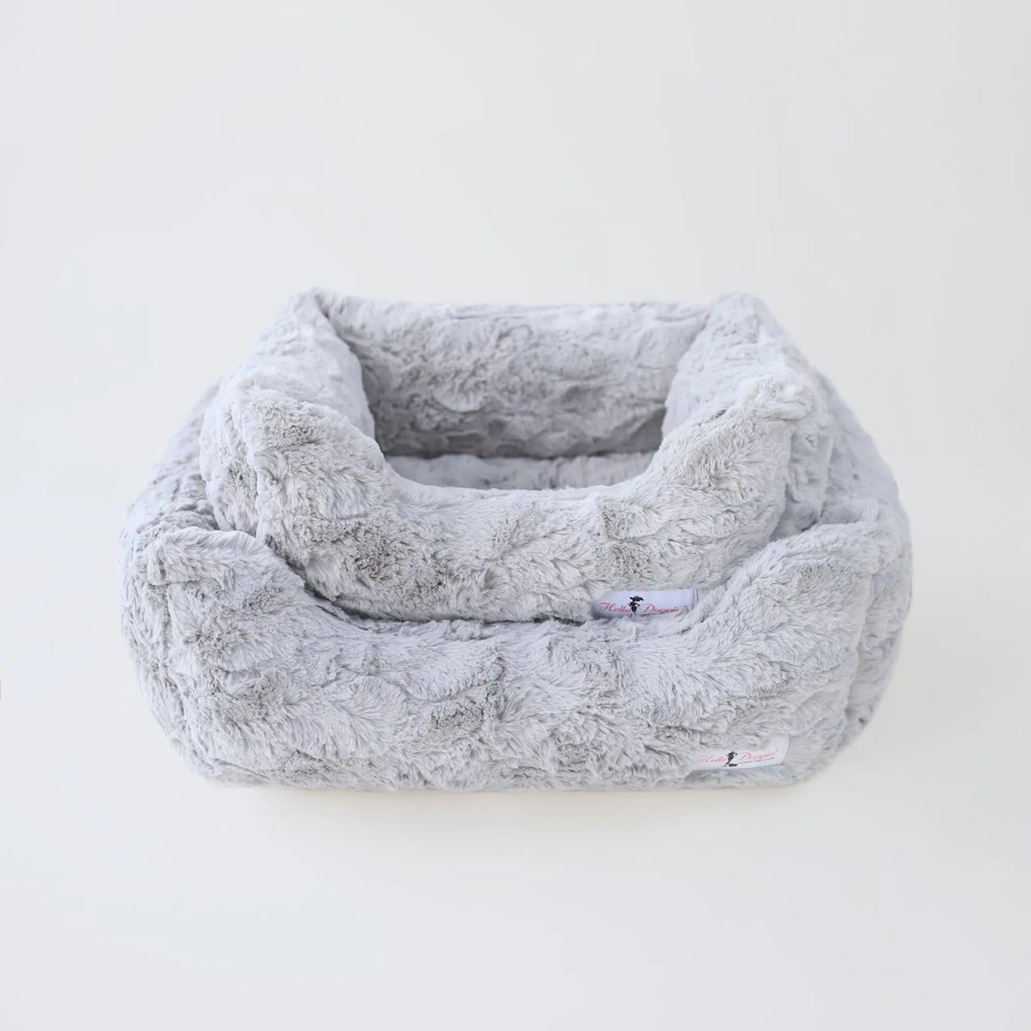 Fluffy gray pet bed on a white background