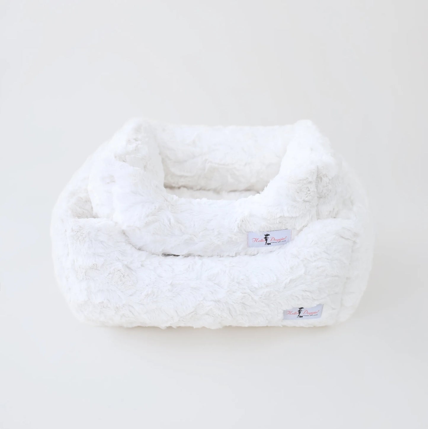 White fluffy pet bed on a white background