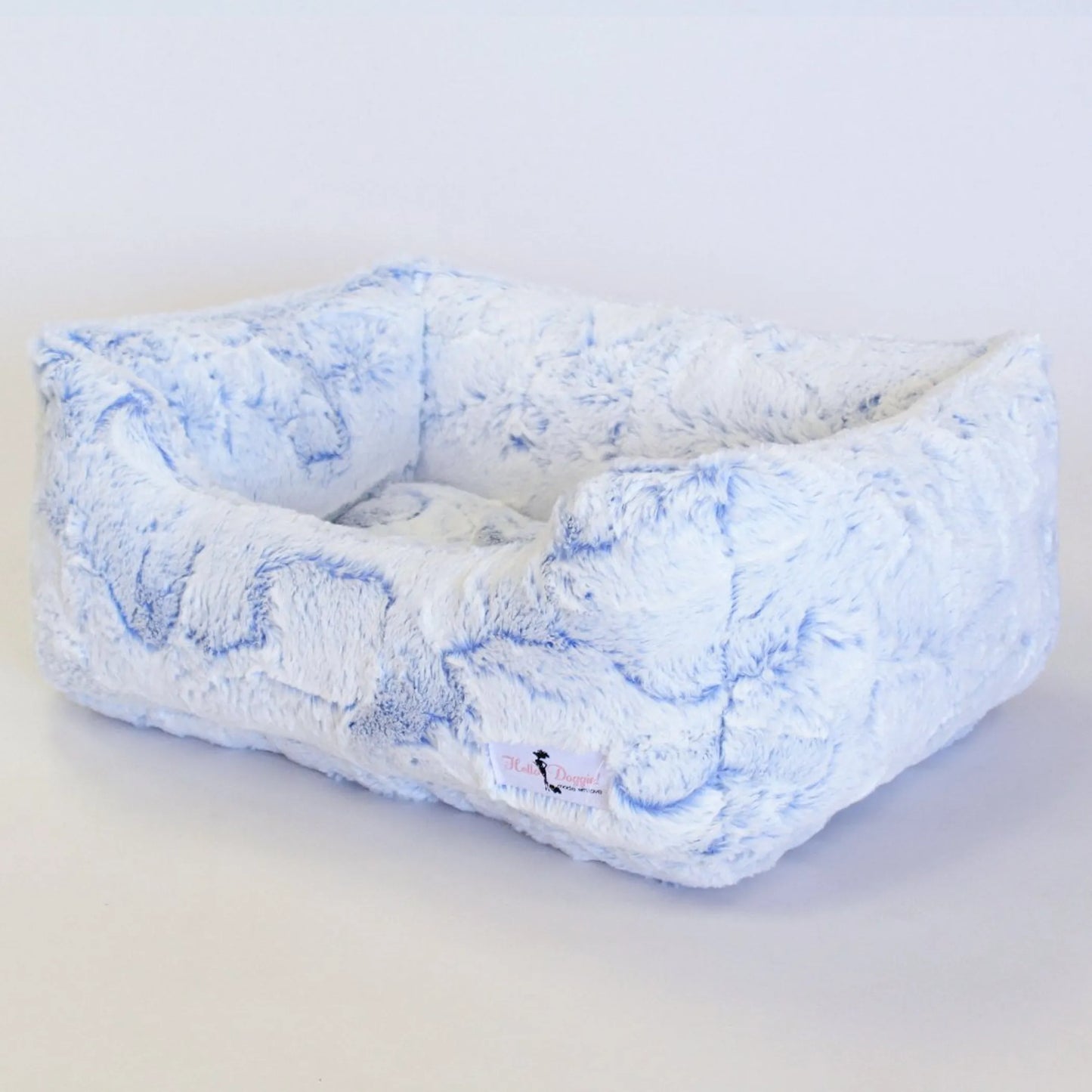 Floral-patterned pet bed on a white background