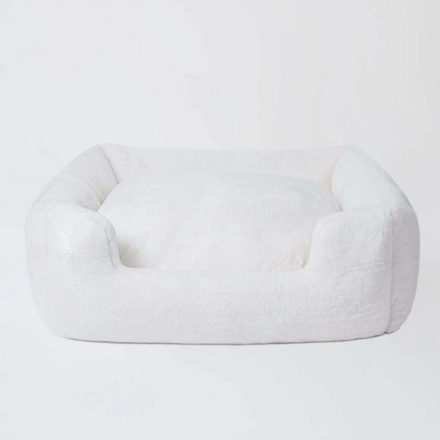 White pet bed on a light gray background